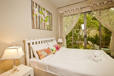 Second Bedroom with View to the Garden, Terrace and the Pool